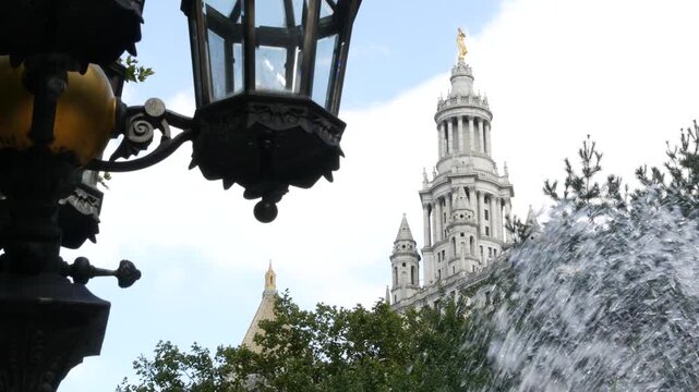 New York City Downtown Civic Center, United States of America. Manhattan municipal building 1914, old historic architecture. Government administration authority from City Hall park. Fountain, lantern.