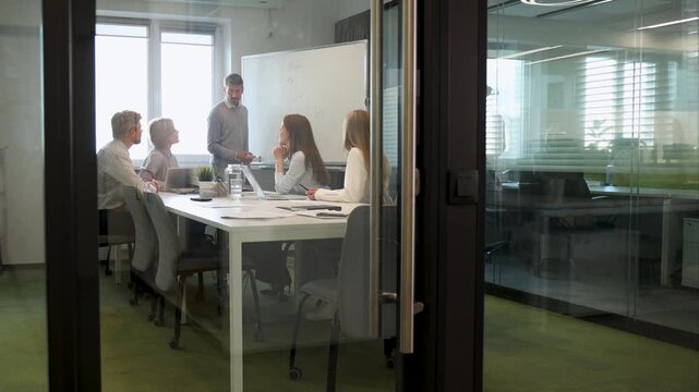 Group of happy progressive business people working on startup together at creative office