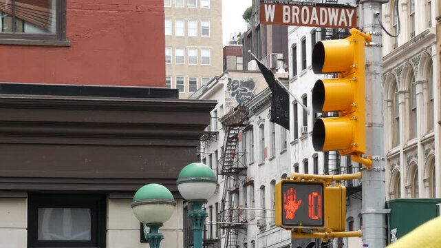 New York West Broadway street sign in Lower Manhattan, United States. Urban road sign in american city, traffic sign in NYC. Architecture of Tribeca district. Subway entrance green globe, orb lamp.