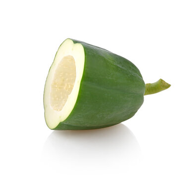 Half of green papaya with pedicle isolated on white background