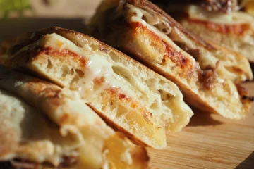 Fototapeten Snack Melted cheese sandwich served on a wooden board  © Towfiqu Barbhuiya 