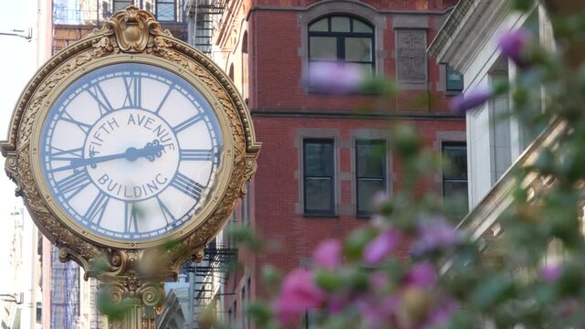 New York City Manhattan Midtown, United States of America. Street Clock on Broadway in Flatiron district near Madison Square Park. 5 fifth avenue Nomad area. Iconic golden clock, vintage clock face.