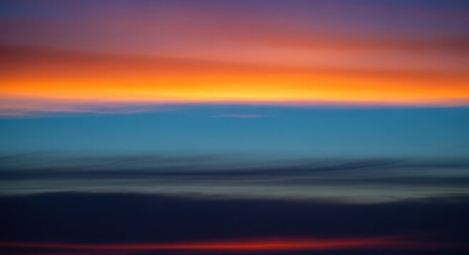 The quiet moment just before dawn. The sky glows with faint orange and blue light as the long, dark hours come to an end, purple, dawn, glow
