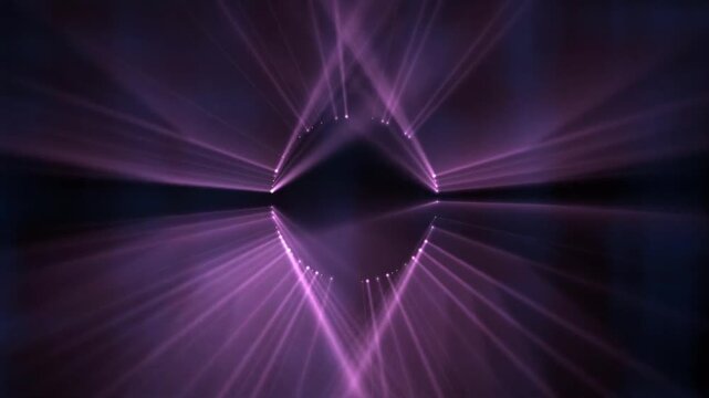 Pink purple stage lights rotating in circular motion forming glowing star patterns on black background