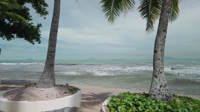 Tropical Beach Landscape with Coconut Palm Trees and Island View in Anyer Banten