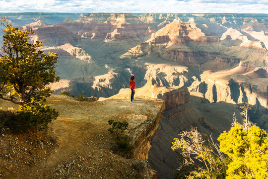 Woman admiring grand canyon national park landscape at viewpoint