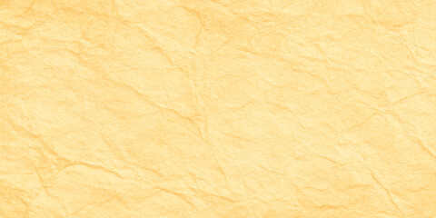 Fototapeta premium Crumpled yellow paper texture background with wrinkles and creases for design and craft projects