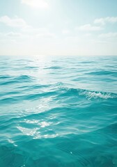 Fototapeta premium Gentle turquoise ocean water surface texture rippled by a refreshing coastal breeze under a bright summer sky, symbolizing natural tranquility, turquoise, nature, background