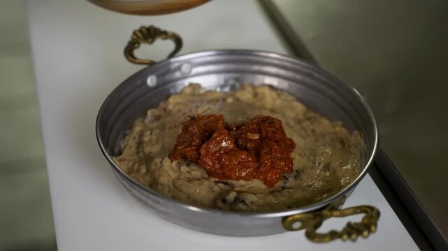 Traditional Turkish H&uuml;nkar Beğendi Served with Slow-Cooked Beef