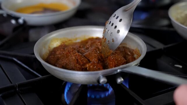 Chef Cooking Traditional Turkish Beef Stew for H&uuml;nkar Beğendi