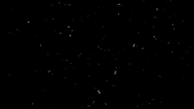 Fine white dust and debris particles slowly float and drift against a dark black background