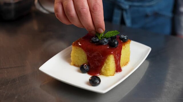 Turkish Revani Dessert with Plum Sauce, Blueberries and Mint Garnish