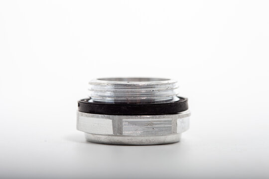 Air compressor oil sight glass for lubricant level monitoring, transparent plastic window plug for industrial pump maintenance, mechanical component context for crankcase fluid inspection