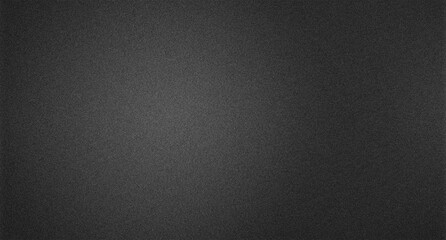 Obraz premium Dark gray textured background, abstract charcoal surface with subtle grain, elegant black backdrop for design, modern minimalist wallpaper 4K grainy texture Background