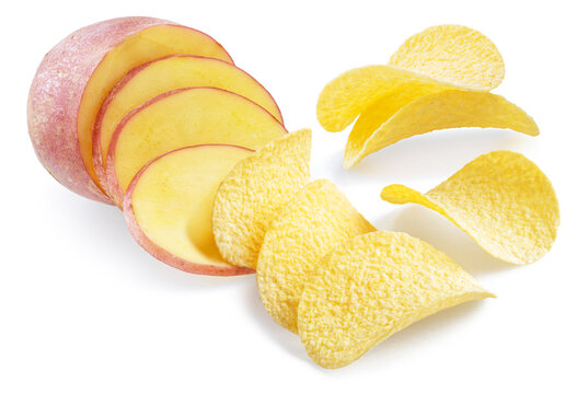 Golden crispy potato chips and fresh potato slices isolated on a white background. Concept of fresh organic produce "straight from the garden".