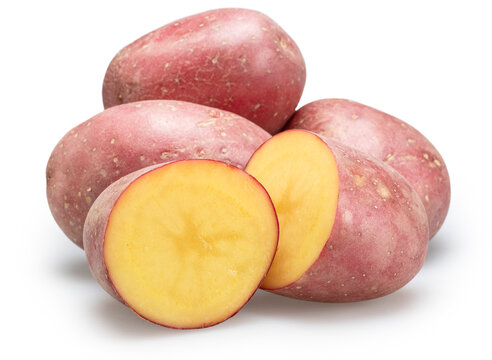 Whole and sliced raw red potatoes isolated on a white background. Organic food