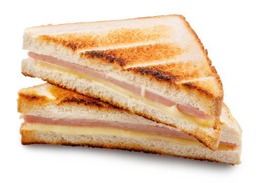 Delicious grilled ham and cheese sandwich cut into triangles and isolated on a white background