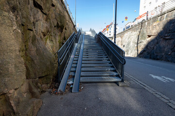 Obraz premium steel staircase with rails for strollers between apartment buildings