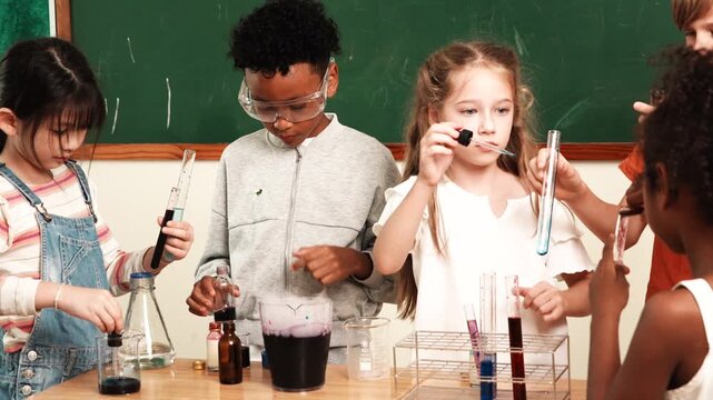 A group of boys and girls, of multinational nationality, friends stand in front of their classmates learning science, mixing chemicals, holding test tubes, having fun with experiments in their classro
