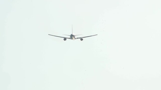 Airplane glides calm sky. No people visible in frame. Simple motion suggests travel or transit. Ideal for aviation, travel, or quiet journey themes