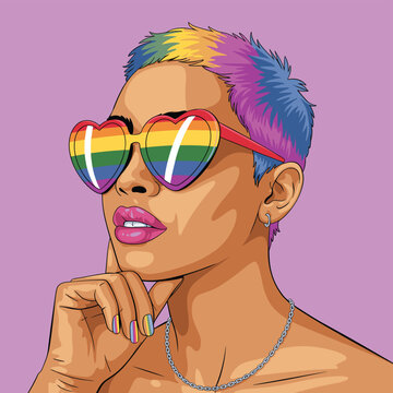 A stylish person with short rainbow hair wearing heart-shaped rainbow sunglasses representing LGBTQ+ pride