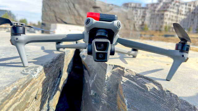 Drone rests beside a narrow stone crevice
