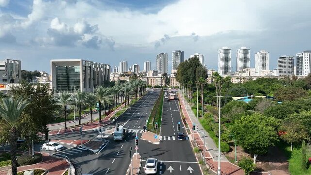 High Angle Aerial Drone Shot of a Wide City Avenue and Modern Residential Skyscrapers in Kiryat Bialik