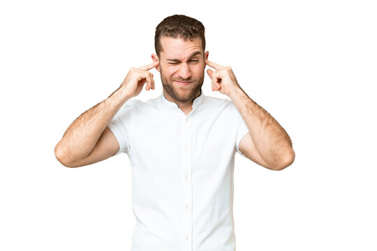 Young handsome blonde man over isolated chroma key background frustrated and covering ears