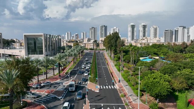 High Angle Aerial Drone Shot of a Wide City Avenue and Modern Residential Skyscrapers in Kiryat Bialik