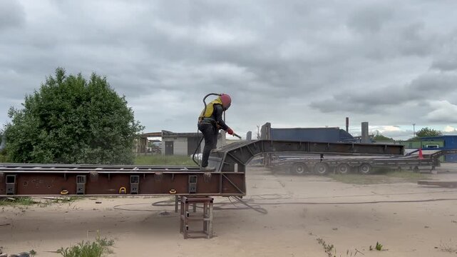 man with sandblaster