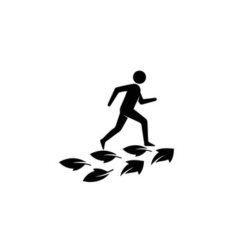 Silhouette of a person running on a path of arrows, symbolizing progress and direction