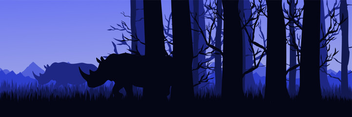 Mysterious evening forest scene bold rhino silhouette © FahrizalNurMuhammad