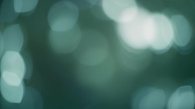 Green bokeh lights background texture.