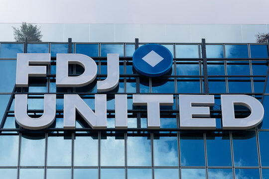Sign and logo on the headquarters of FDJ United, formerly Fran aise des Jeux, operator of lottery, online games and sports betting markets