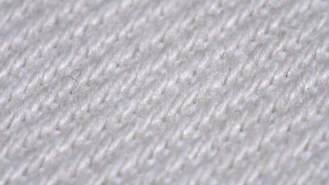 Macro view of white knitted wool fabric texture s.