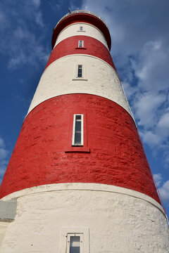 Towering Red and White Lighthouse in Scotland