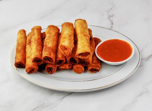 Crispy Filipino pork shanghai spring rolls with sweet chili dipping sauce