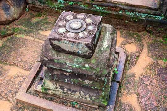 Ancient sandstone pedestal with carved lotus flower, Banteay Srei, Angkor.