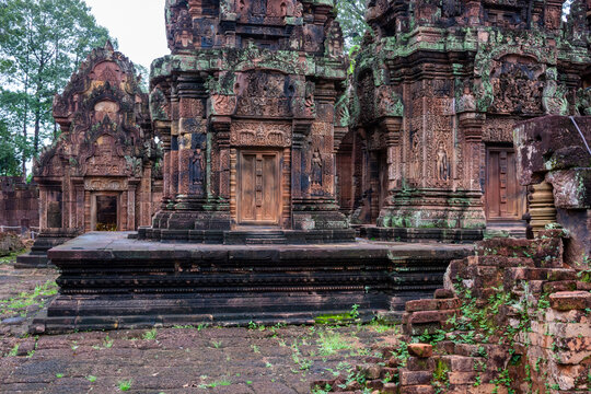 Pink sandstone sanctuaries and prasat towers at Banteay Srei temple, Angkor.