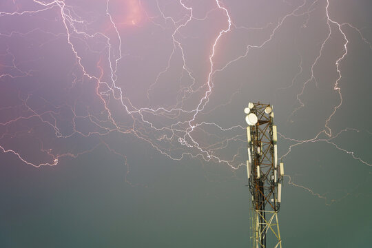 Lightning Strikes Near Communication Tower Under Dramatic Sky