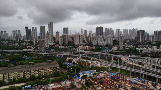 Scenic Aerial View of Mumbai Skyline During Monsoon Season with Modern Skyscrapers, High Rise Buildings, Cloudy Weather, Rain Covered Urban Landscape, Coastal Cityscape and Dramatic Metropolitan Archi