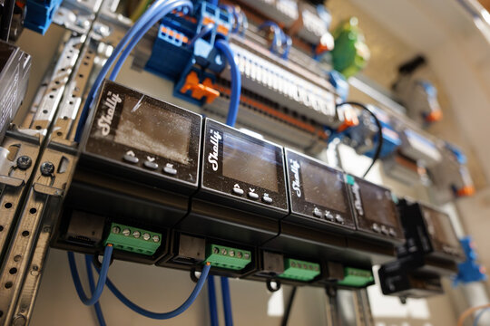 DRESDEN, GERMANY - 17. February 2026: Shelly Pro 4PM smart switch modules in a domestic fuse box. Close-up of a smart home system. Electronic product in a residential context.