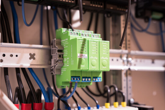 DRESDEN, GERMANY - 17. February 2026: Shelly Pro Dimmer 2PM modules in a domestic fuse box. Close-up of a smart home system. Electronic product in a residential context.