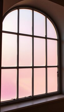 Frosted window panes melt into a soft, dreamlike pastel haze, captured from an unusual angle,  dutch angle,  pastel