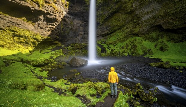 Tourist at Kvernufoss waterfall, in summer when the weather is fine, gorge and river, Skogar, Sudurland, South Iceland, Iceland