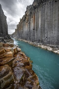 Stu&eth;lagil Canyon, turquoise river between basalt columns, Egilsstadir, Iceland