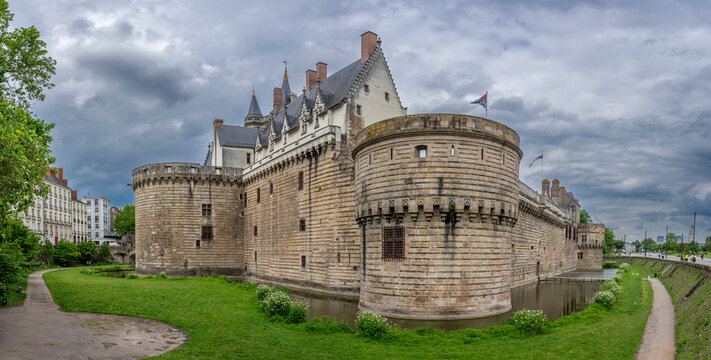 Nantes, France - 05 07 2026: Castle of the Dukes of Brittany. Panoramic view of the fortified castle with dungeons and moats