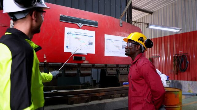 Team meeting on safety protocols manufacturing facility training session industrial environment close-up view workplace safety