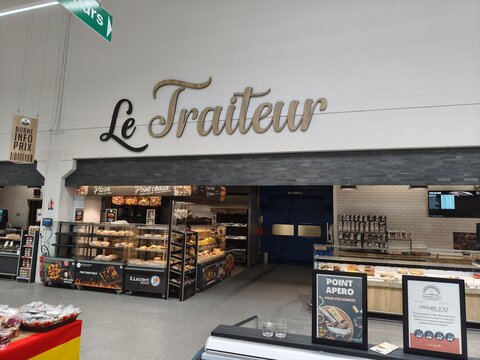 Royan, France - May 10, 2026: E.Leclerc. Le Traiteur deli counter with a variety of prepared foods and signage in a modern grocery store interior
