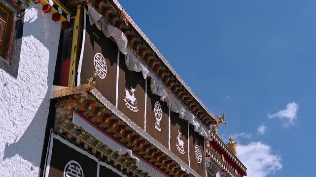 Cinematic Low-Angle Shot in Songzanlin Temple Square - Looking Up at Gilded Facades, Yunnan China